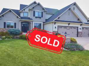 Pre-Listing Paint Checklist: What Sells Best in Atlanta Right Now - Big house with a sign that says "sold"