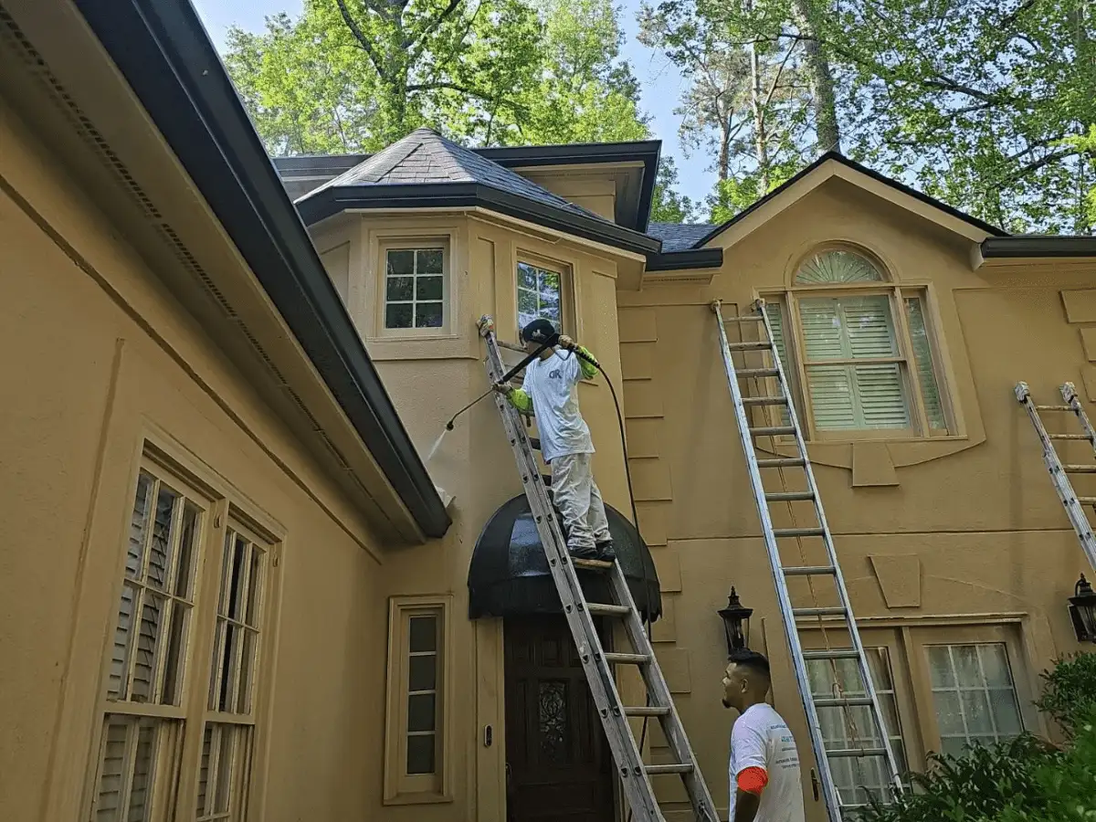 Our Proper Prep Work in Exterior Painting - Painters doing pressure washing