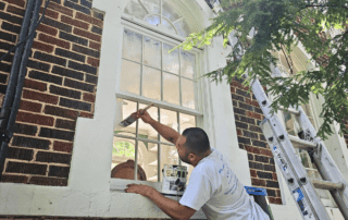 The Truth About Cheap Paint Jobs: Why Quality Matters - Painter painting window trim with care