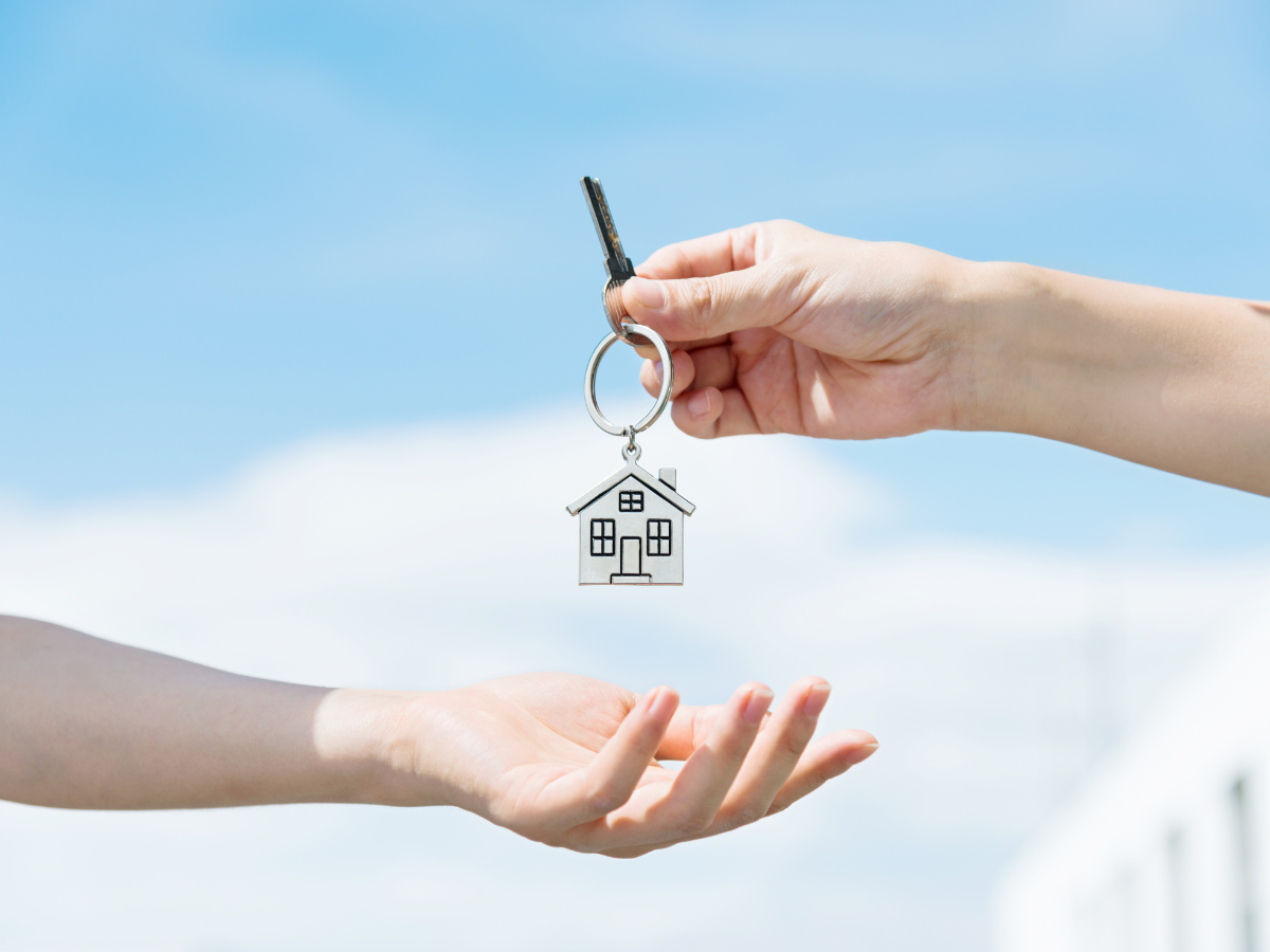 Color Psychology: Best Shades to Help Sell a Home - handing house keys