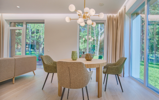 Stop Losing Buyers to Color Chaos: How to Create Flow Across Every Room - Cohesive dining room