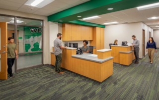 How Color Impacts School Branding, Culture & Wayfinding - school office with green walls