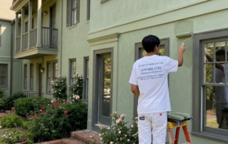 Why Every Atlanta Townhome Community Should Have a 5‑Year Painting Maintenance Plan - Atlanta's Paint Doctor team doing maintenace painting to the exterior of townhomes