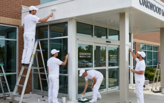 How to Choose a Commercial Painting Contractor for Your Atlanta Medical Facility - Professionals painters painting the entrance of a medical facility.