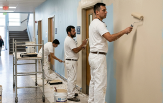 Painters painting school corridors in Metor Atlanta