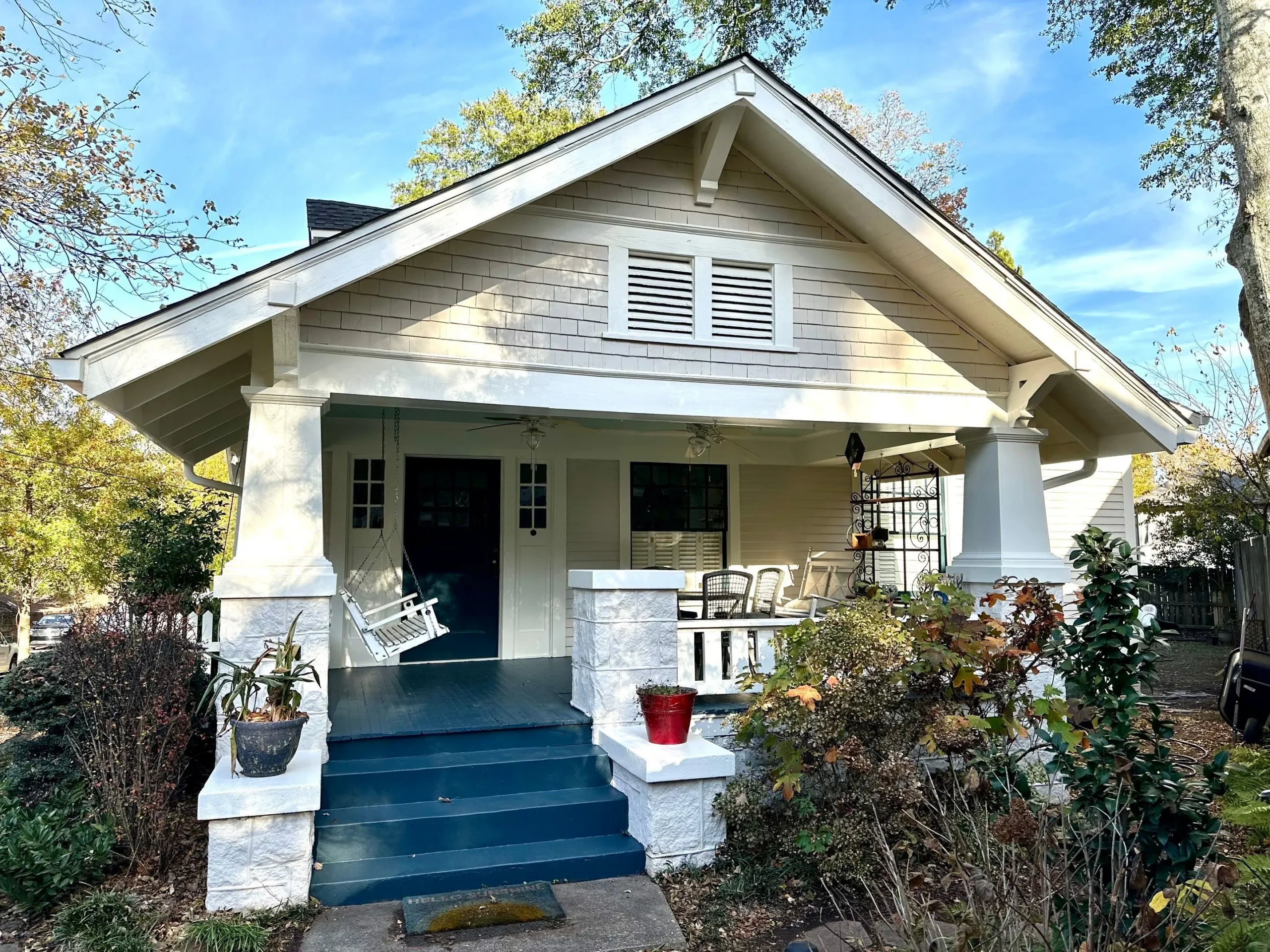 Front Porch Painting North Atlanta Home Inviting front porch of a residential home with a blue painted floor in North Atlanta.