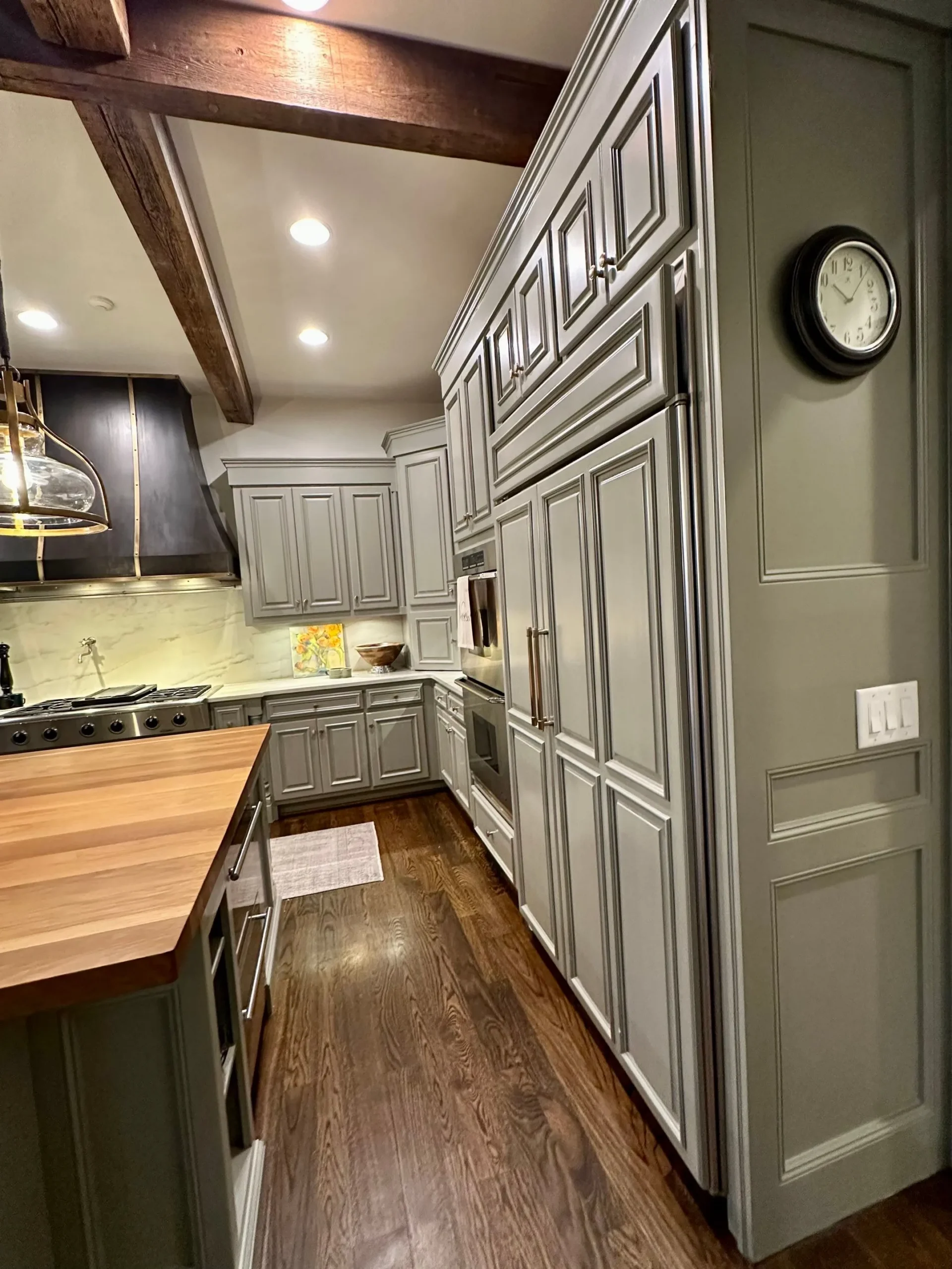 Full Kitchen Cabinet Painting Services North Atlanta Grey painted kitchen cabinets with dark trim and wood beams in a North Atlanta kitchen.