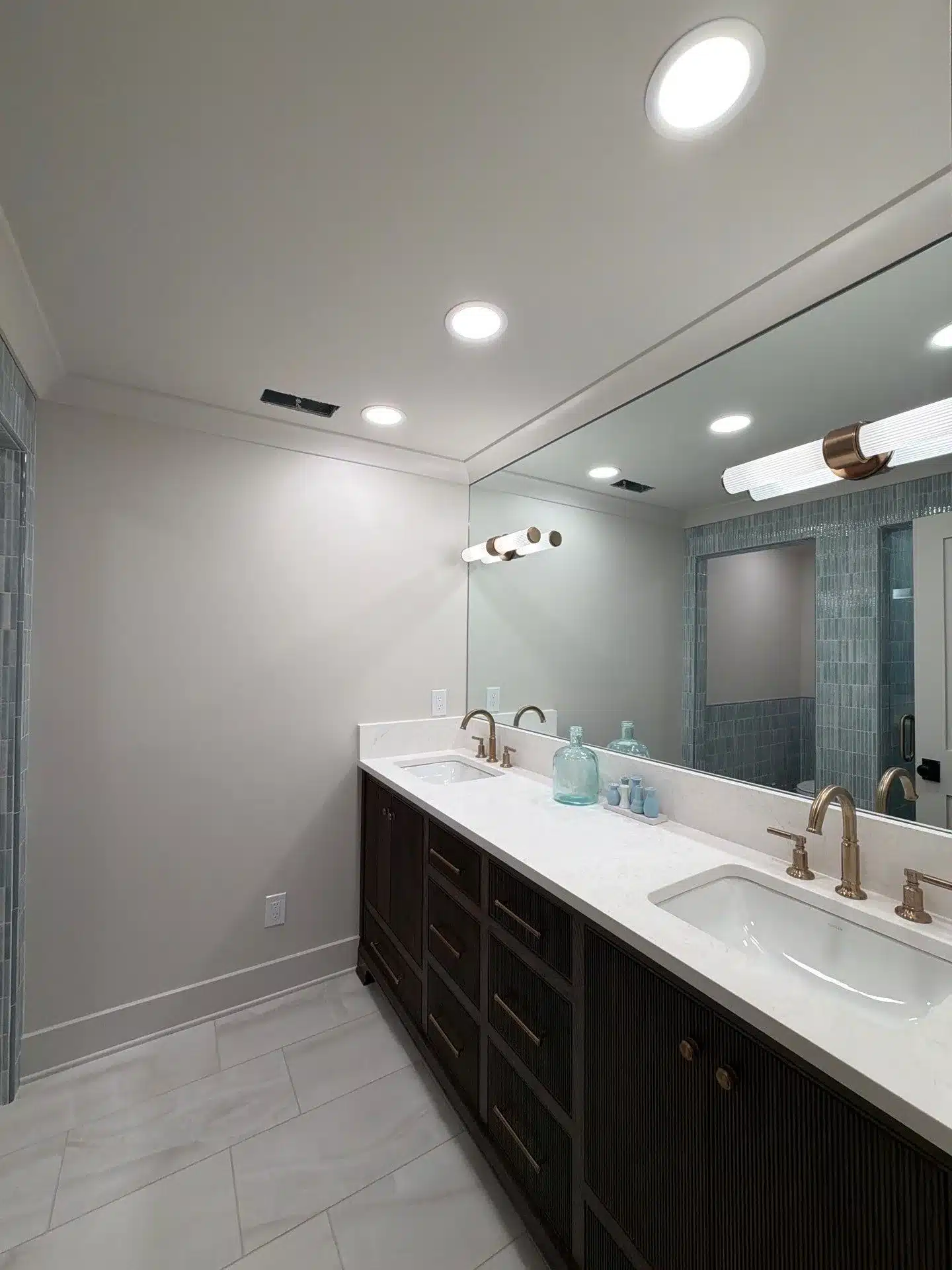 Modern Bathroom With Painted Ceiling Soft gray painted bathroom walls and bright white recessed ceiling with integrated lighting fixtures.